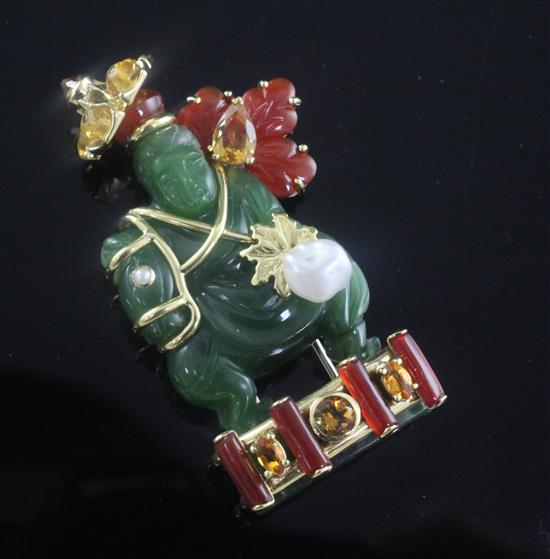 A Seaman Schepps 18ct gold, nephrite and gem set clip brooch modelled as an Oriental gentleman on a horse, 56mm.